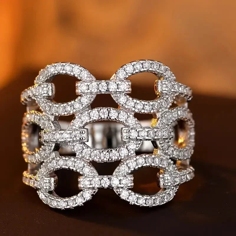Silver-tone statement ring with oval and circular crystal links, high sparkle