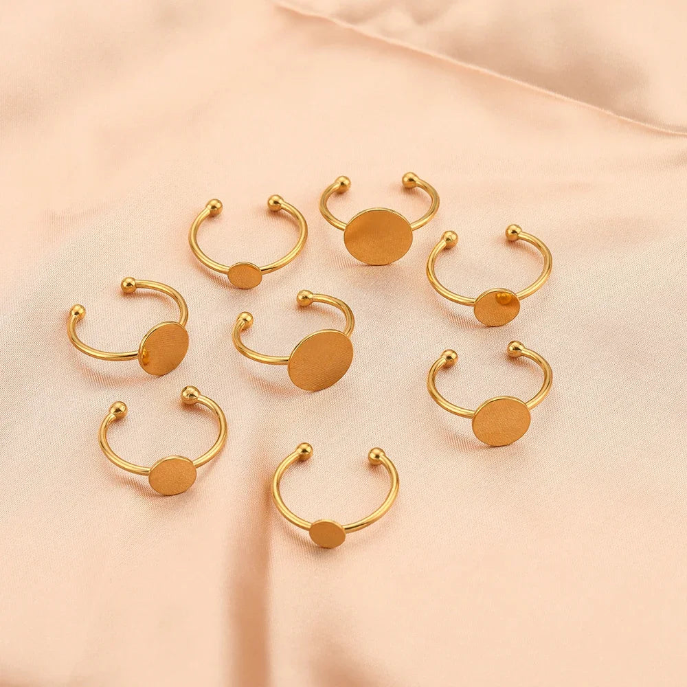 Gold cabochon ring blanks with round bezel discs and ball post accents