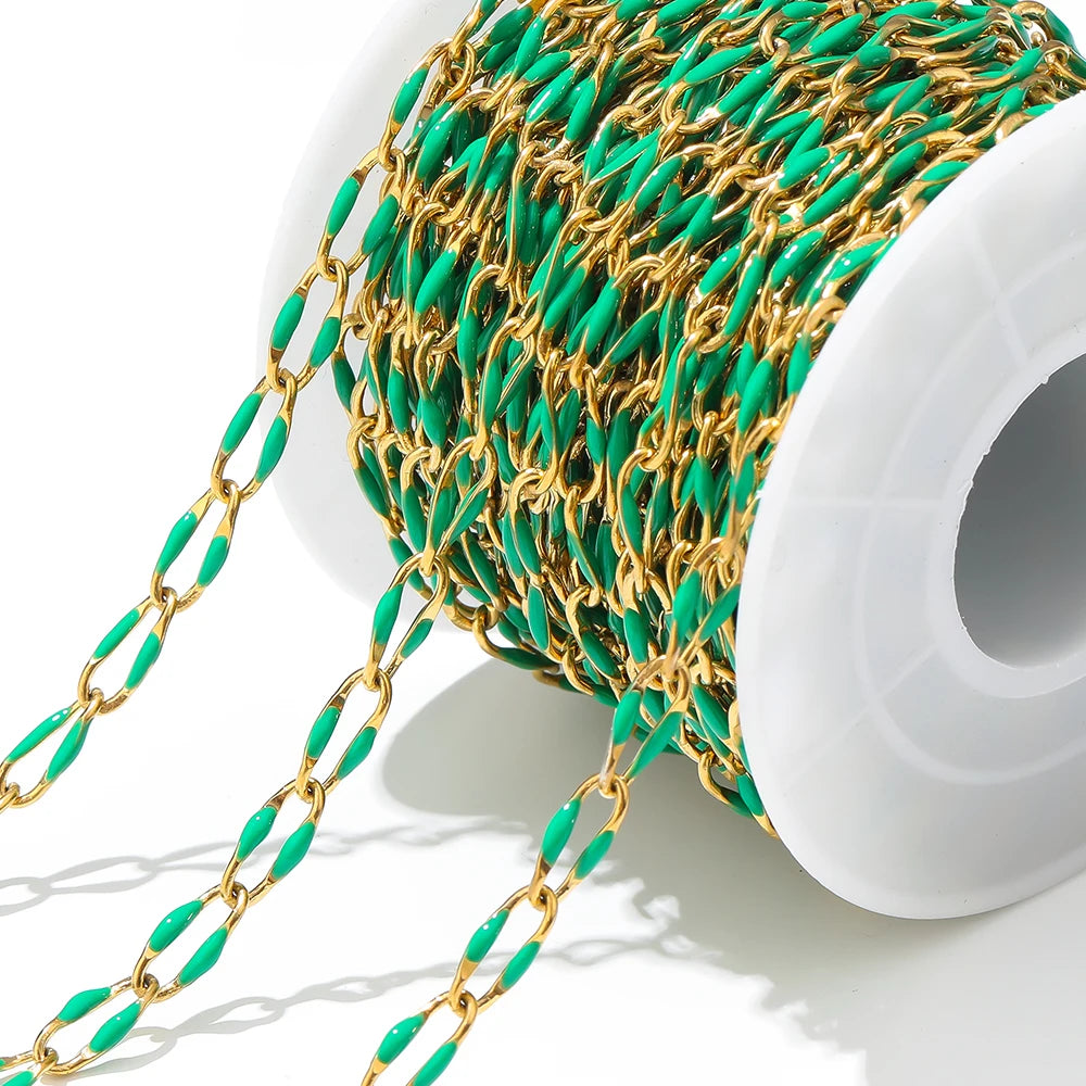 Twisted enamel chain teal and gold oval links on a spool with dangling chain