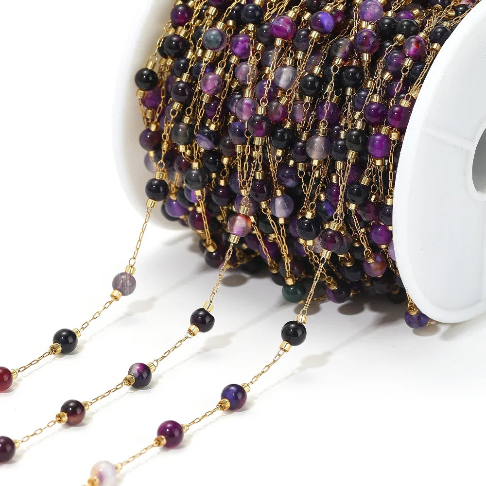 Stainless steel bead chain with gold-tone links and dark purple and black bead drops