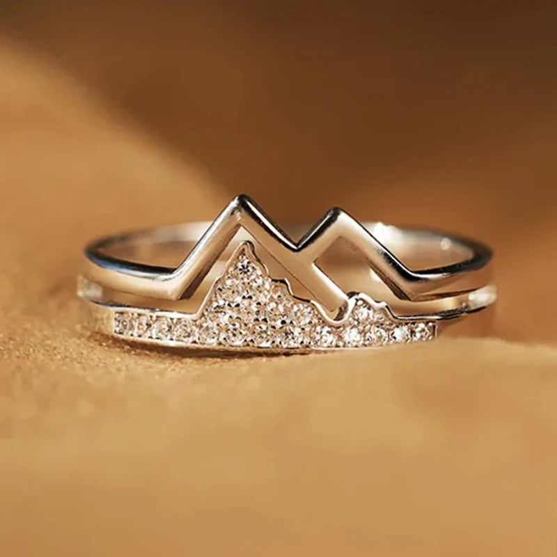 Silver-tone mountain-shaped cubic zirconia ring with raised zigzag peak design