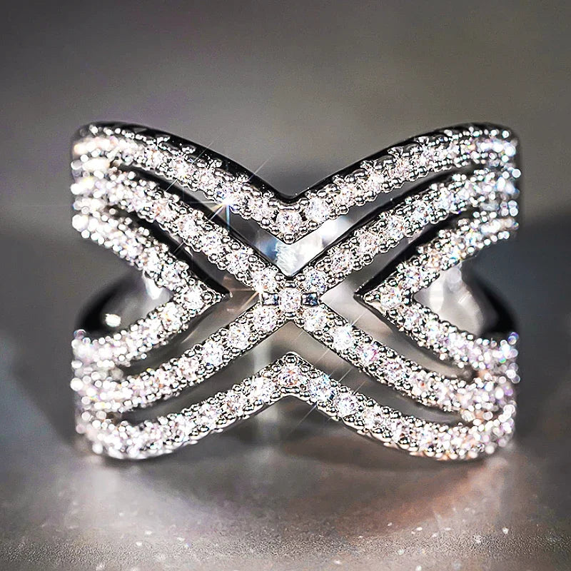 Sparkling crisscross rhinestone openwork ring, bow-like X motif, silver tone