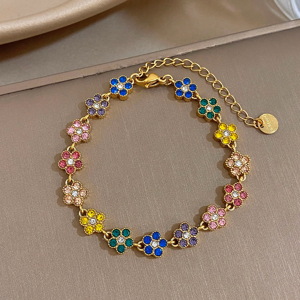 Gold-tone flower zircon bracelet with blue, pink, purple, and yellow bead petals