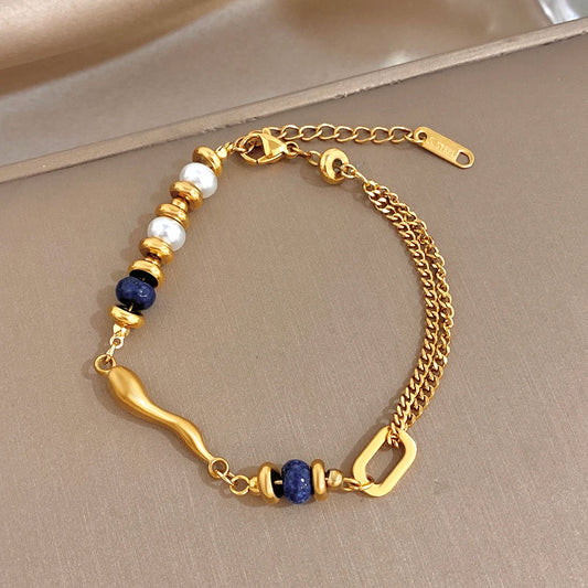Gold-tone beaded bracelet with white and dark-blue beads, double chain links