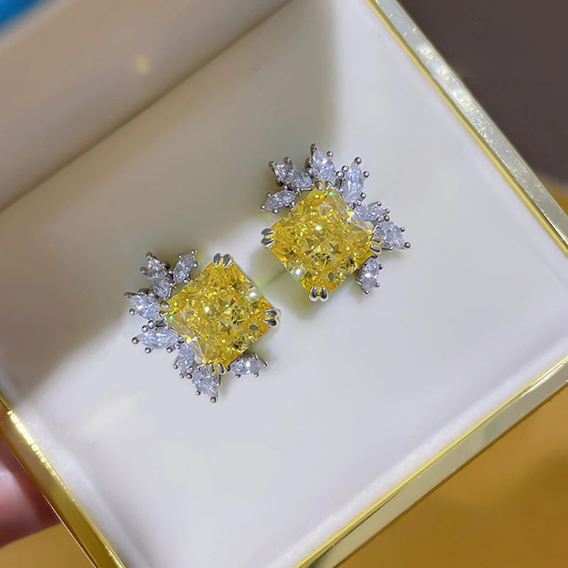 Yellow square cubic zirconia stud earrings with clear crystal halo, in tray