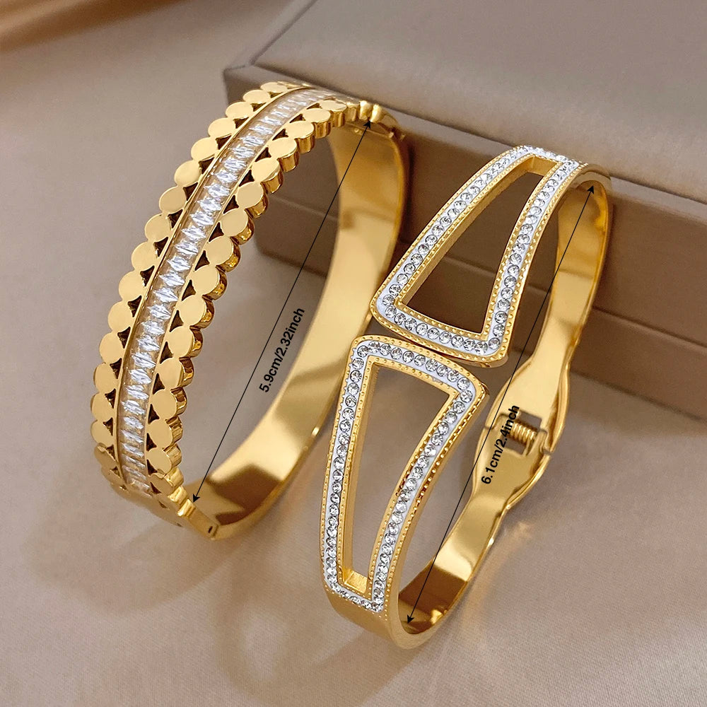 Gold-tone wide cuff bangle set with geometric openwork frame and rhinestone lines