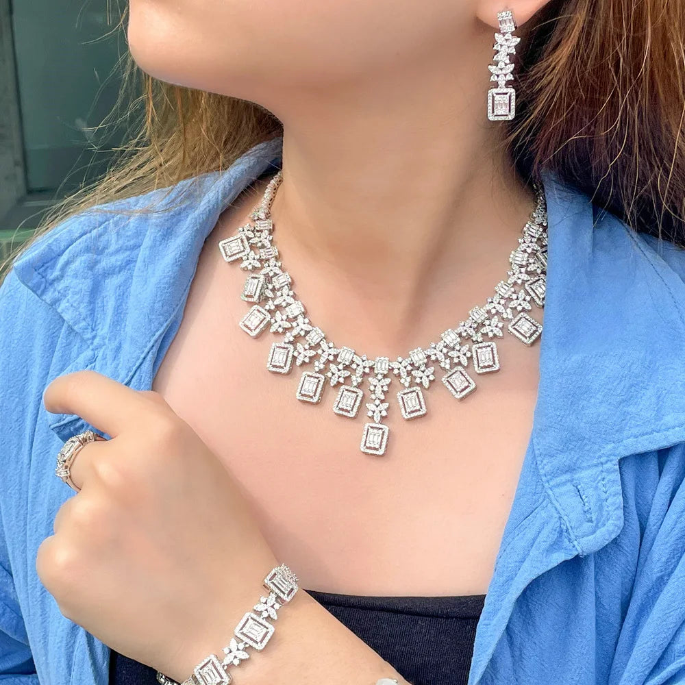 Silver-toned rhinestone necklace with matching drop earrings and bracelet set