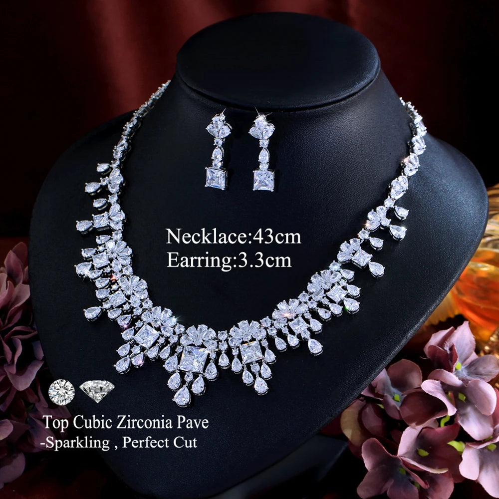 Cubic zirconia necklace with drop earrings set, silver-tone stones, sparkle profile.
