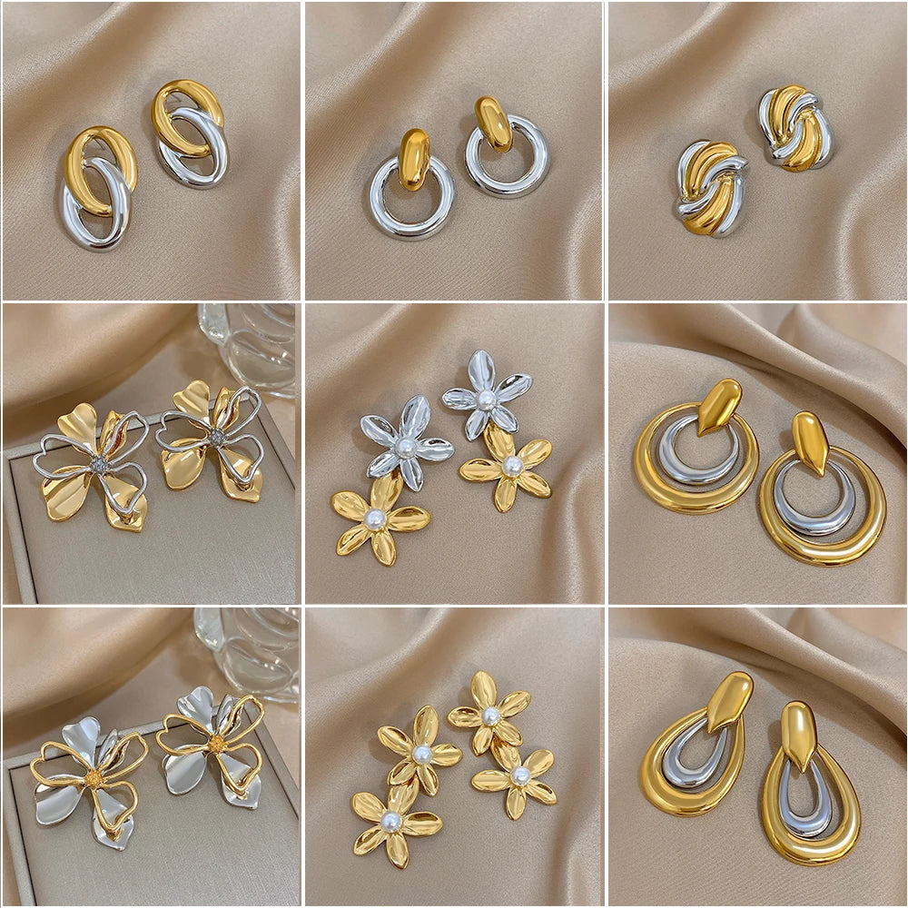 Two-tone geometric earrings in hoop, teardrop, knot, and flower designs