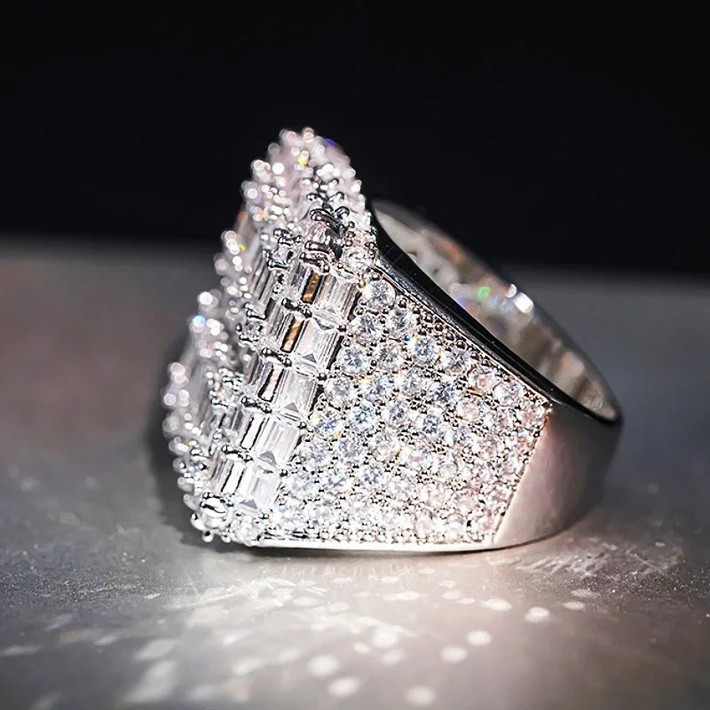 Silver-tone ring with rectangular baguette cubic zirconia across the top band