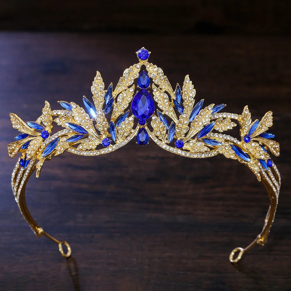 Gold rhinestone tiara headband with dark blue crystals and clear leaf rhinestone details