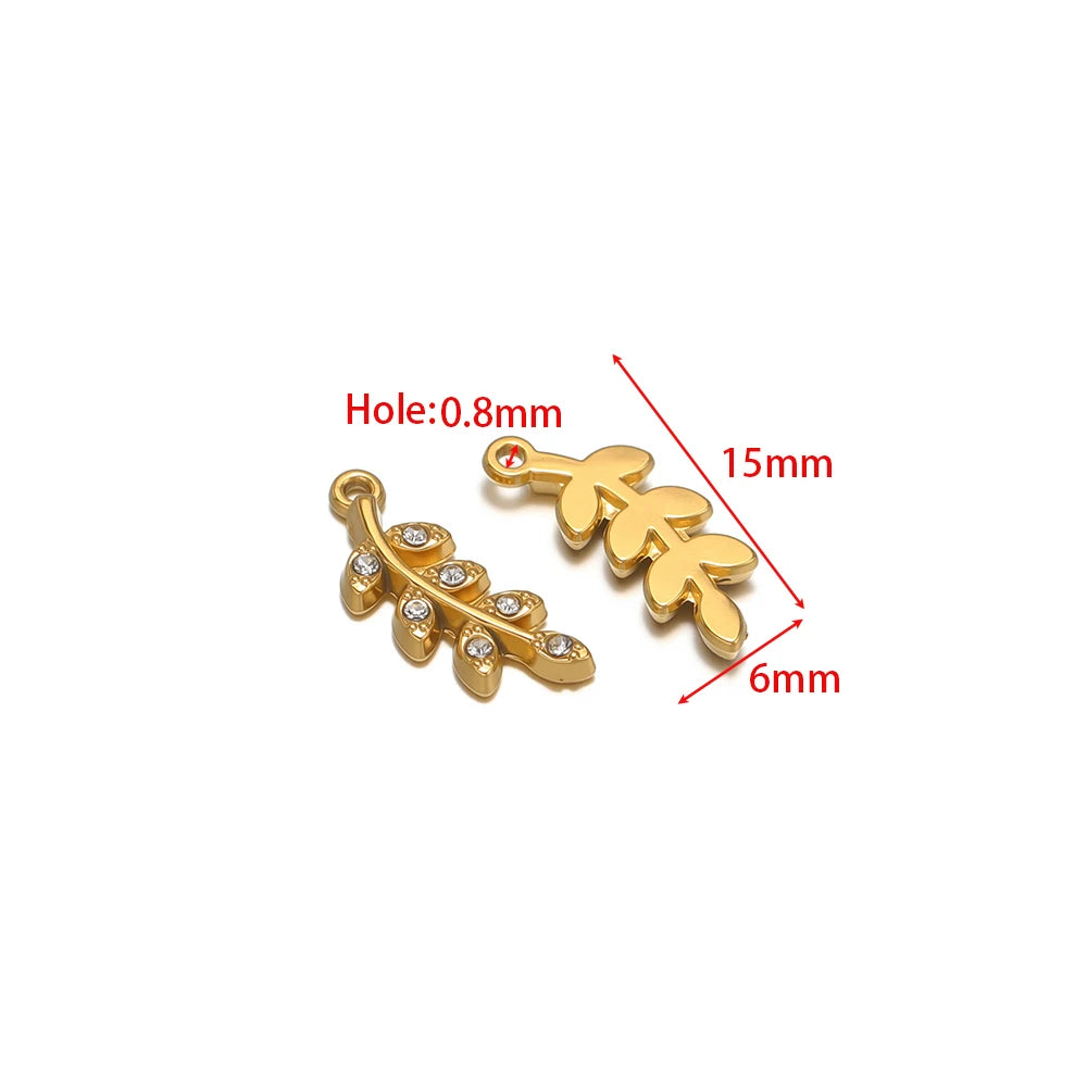 Gold-tone clover charms with clear rhinestones and hanging loop