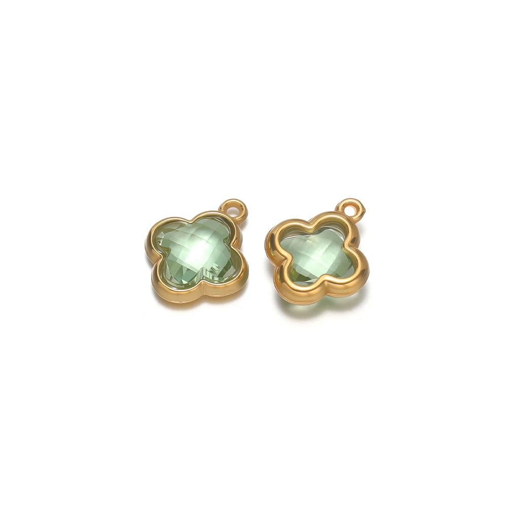 Four-leaf clover glass charm pendant with pale green gem and gold-tone loop