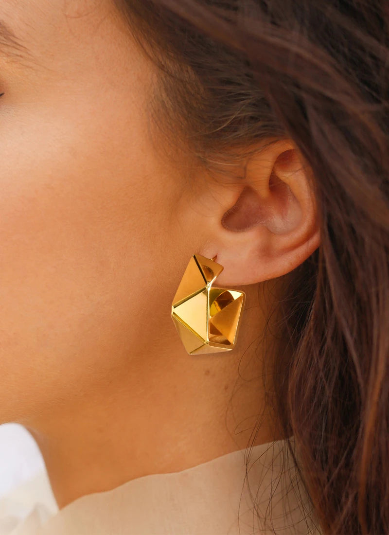 Geometric gold-plated hoop earrings with faceted square cutout