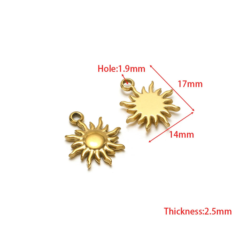 Stainless steel sun and starburst charms with jump ring holes, gold-tone pair
