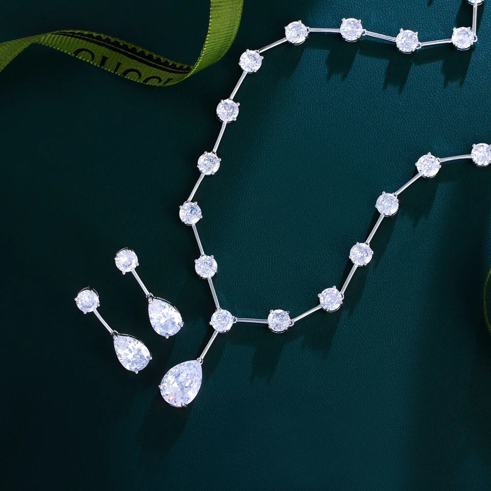 Silver-tone cubic zirconia necklace and hoop earrings, linked round stones with pear drops