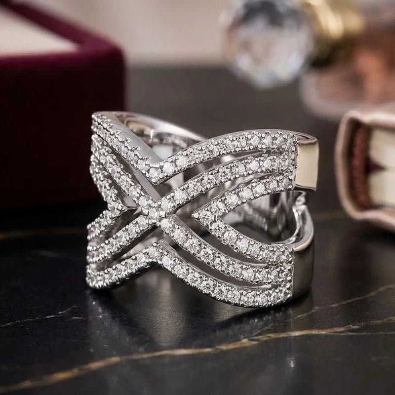 Sparkling CZ hollow cross ring in silver-tone metal