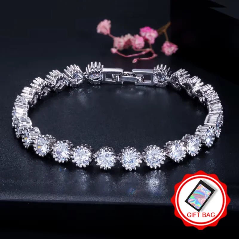 Silver-tone halo CZ tennis bracelet with gift bag icon