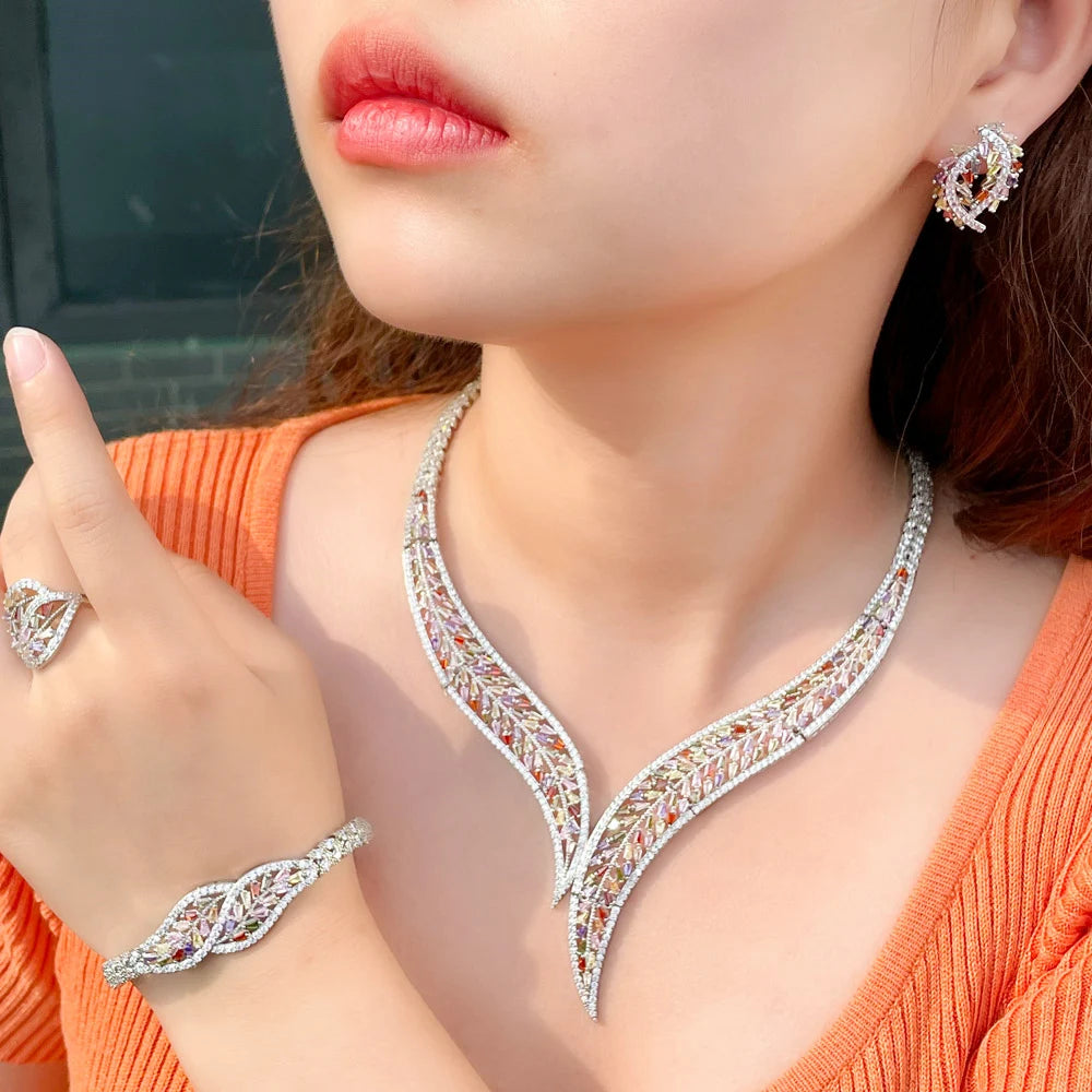 Multicolor CZ leaf necklace with matching bracelet and resizable ring, on model