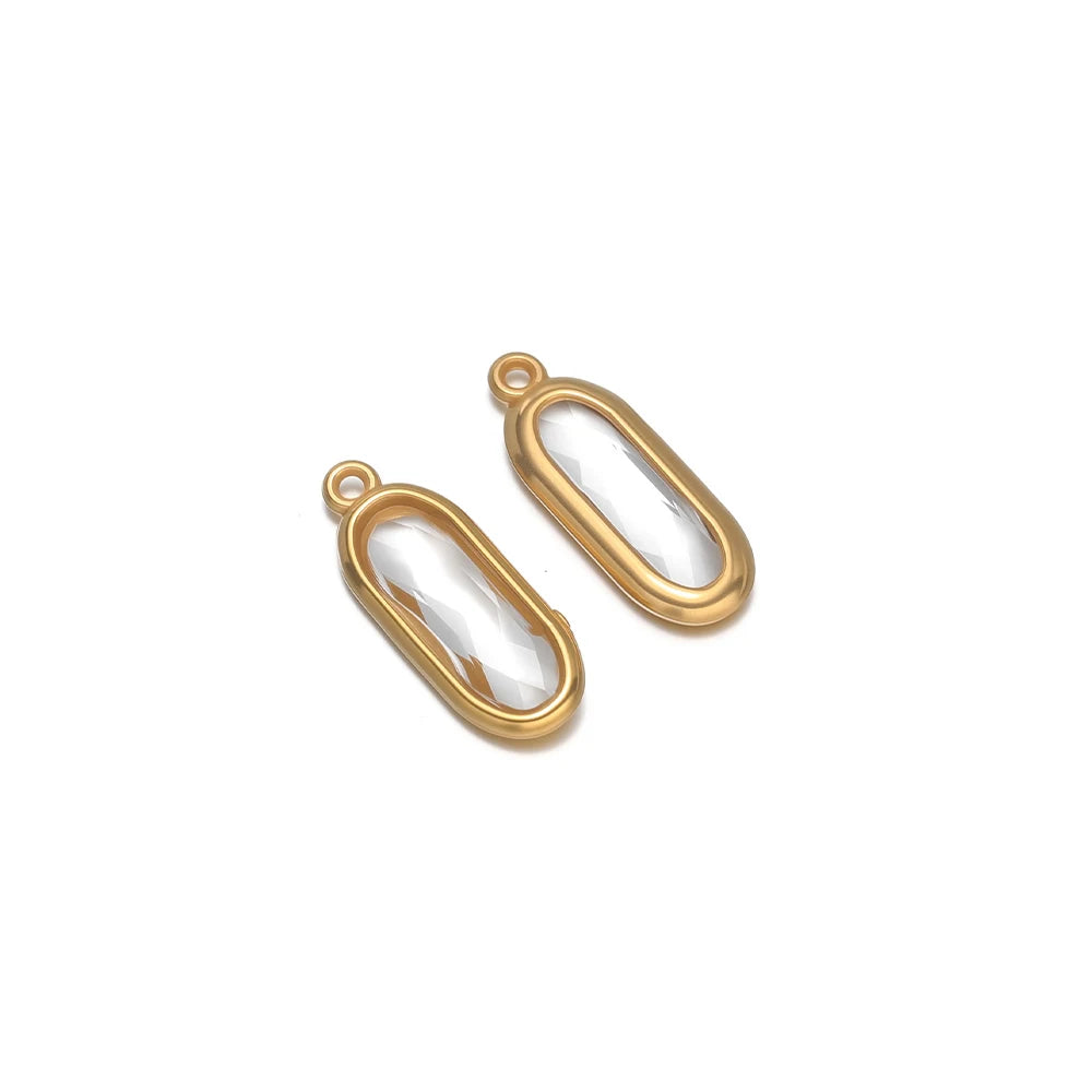Oval glass charm connectors, clear white glass, gold oval frames with connector loops