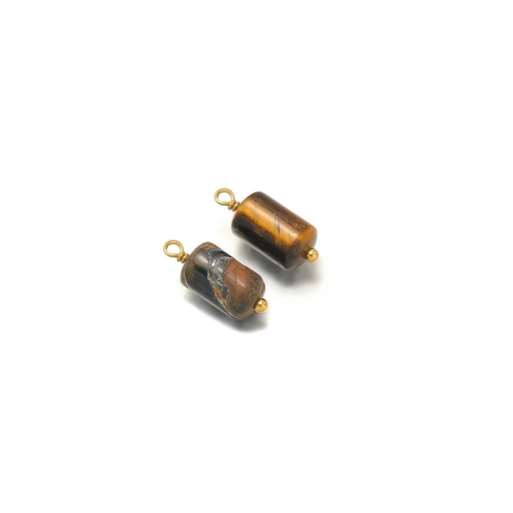 Brown and gray cylinder stone charm pendants with gold-tone loops, two-piece view