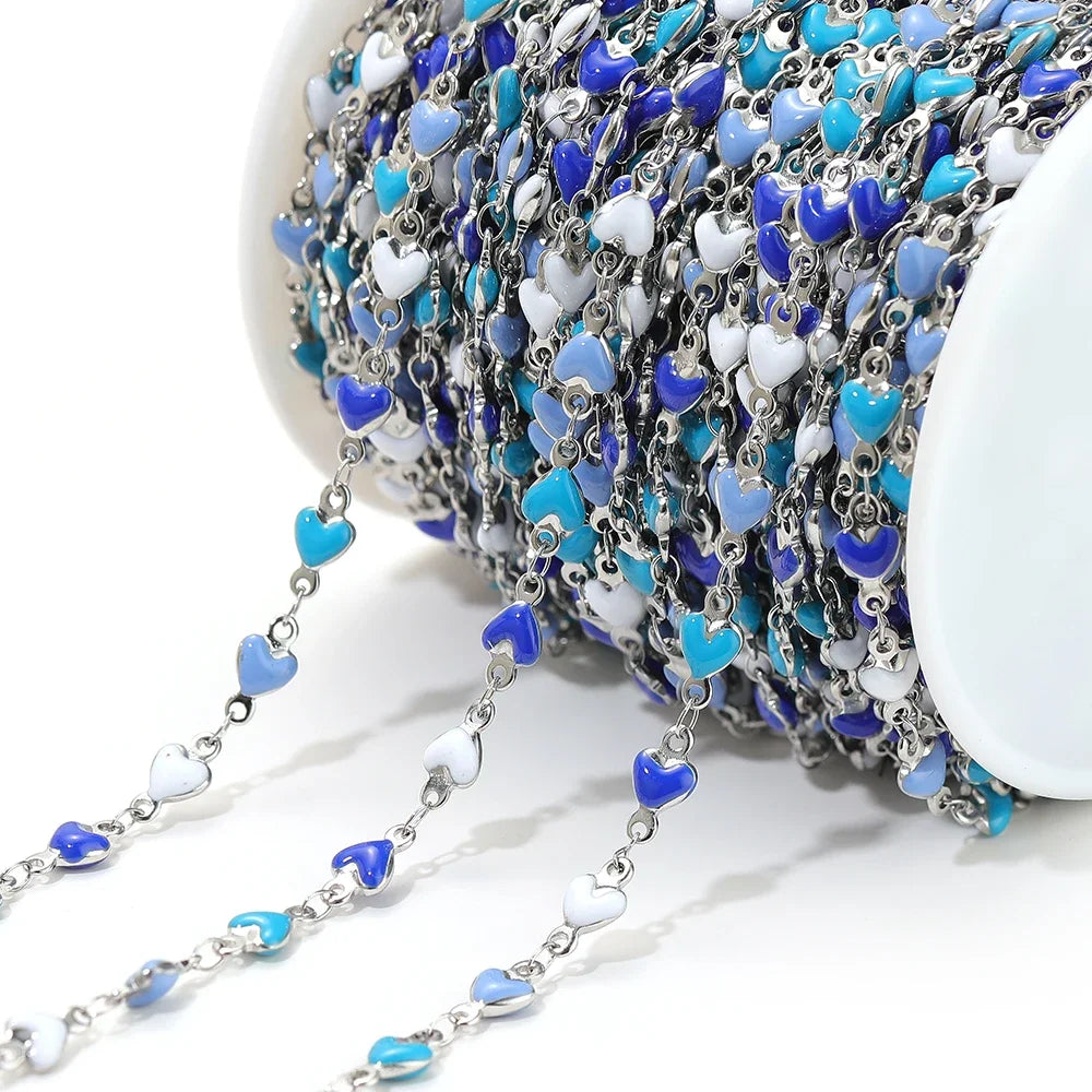 Silver-tone heart link chain with blue enamel heart charms and small links