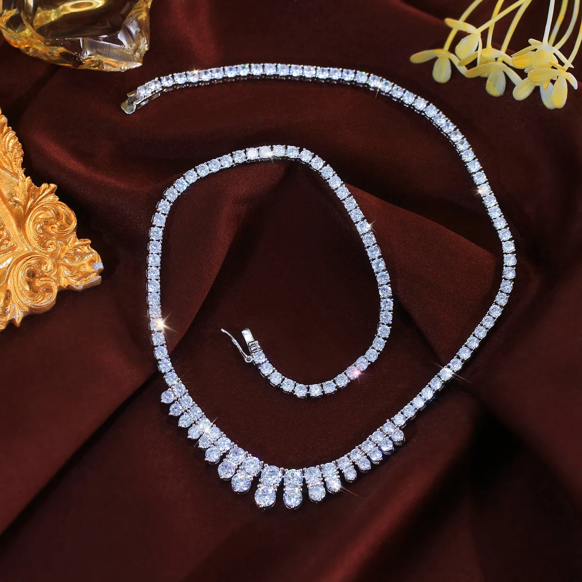 Cubic zirconia necklace laid out to show its full chain and teardrop fringe