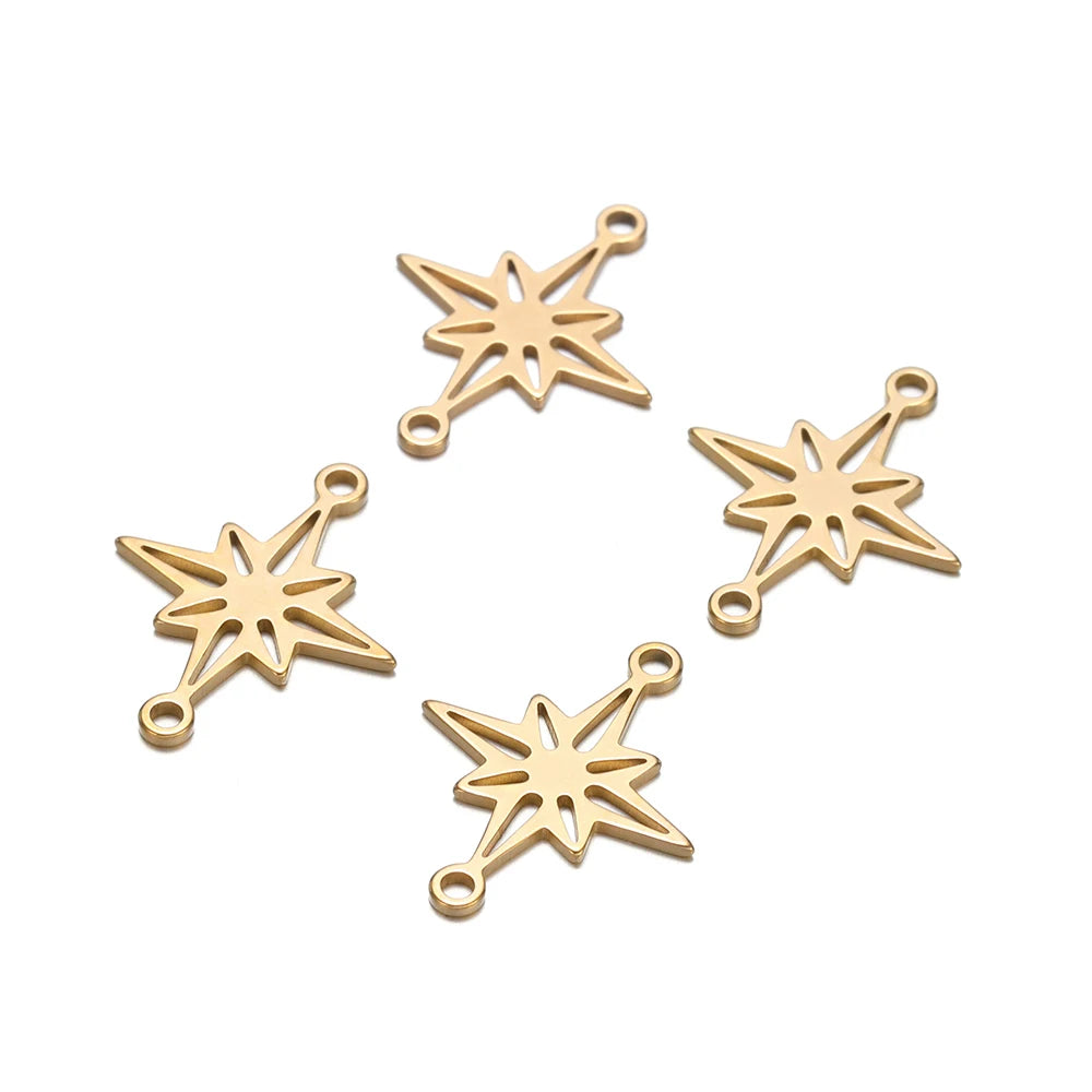 Gold-tone snowflake star charm connectors with looped attachments, assorted layout
