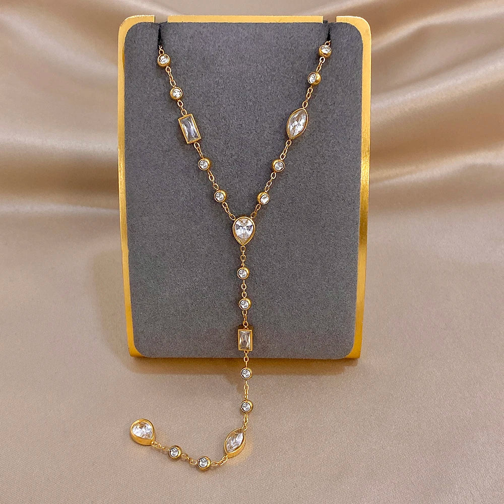 Gold-tone Y choker necklace with oval and rectangular crystal drop charms