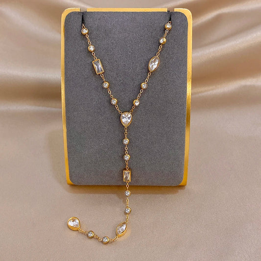 Gold-tone Y choker necklace with oval and rectangular crystal drop charms