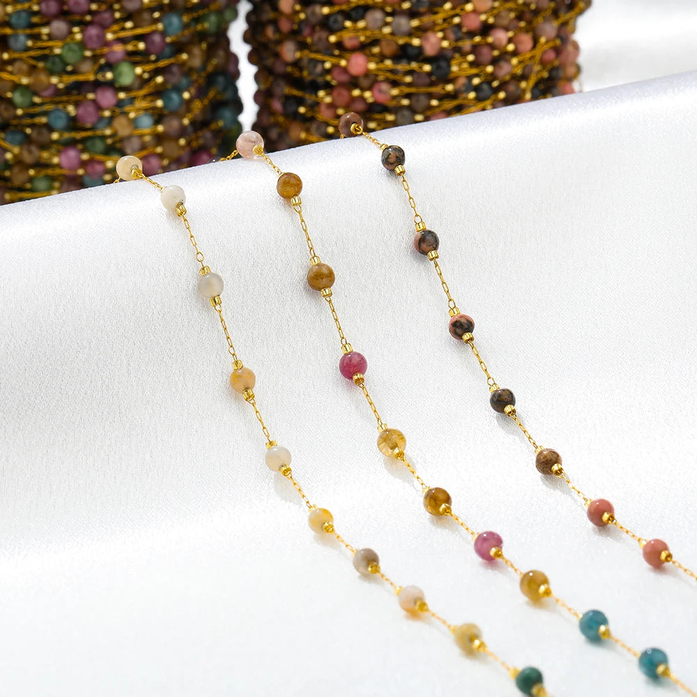 Gold-link gemstone bead chain necklaces with mixed pastel beads in close-up