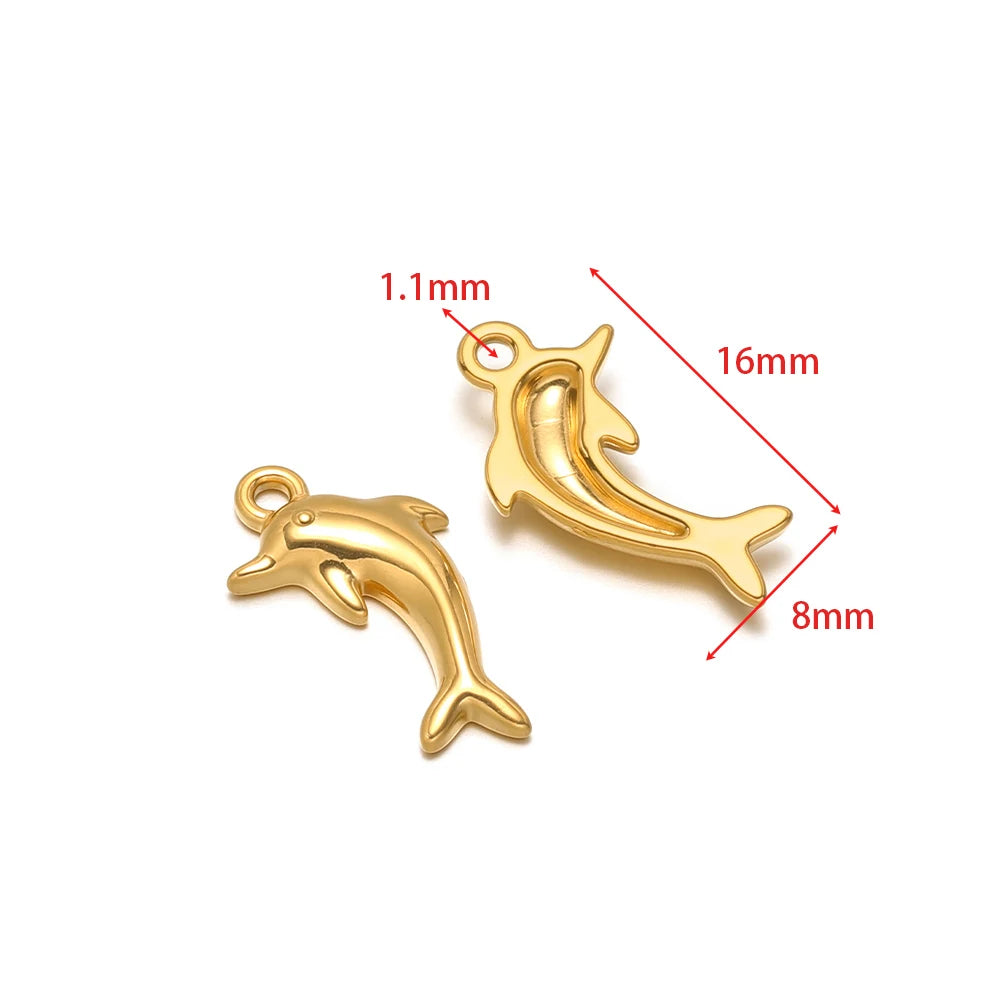 Stainless steel animal charm pendants set, dolphin shaped with gold-tone finish and connector loops
