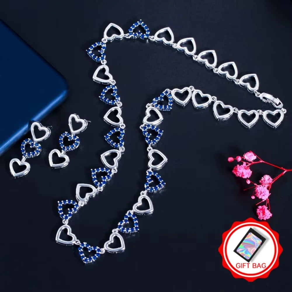 Silver-tone heart necklace and earrings with blue stones