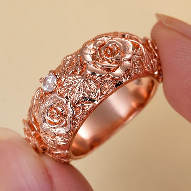 Rose gold rose flower ring with round CZ accents on filigree band