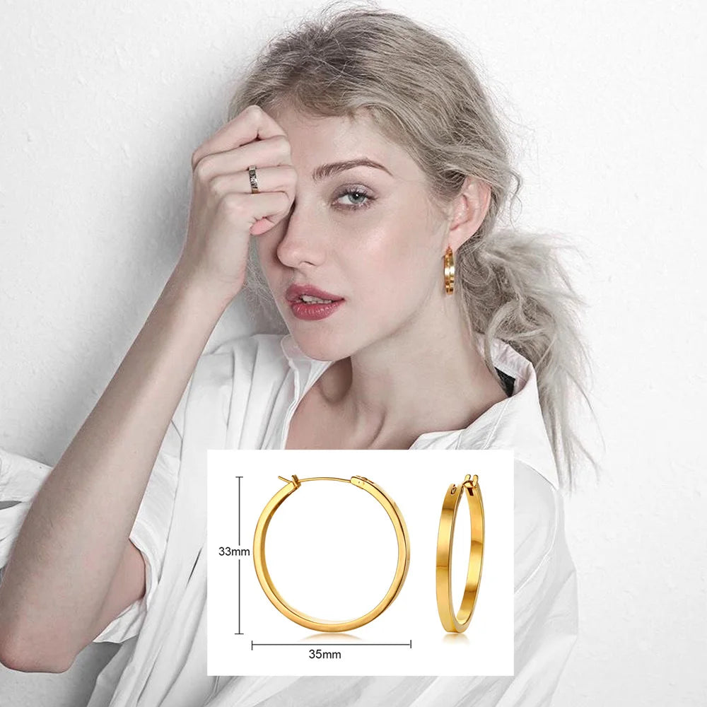 Gold-tone round hoop earrings, 35 mm wide with a slim profile.