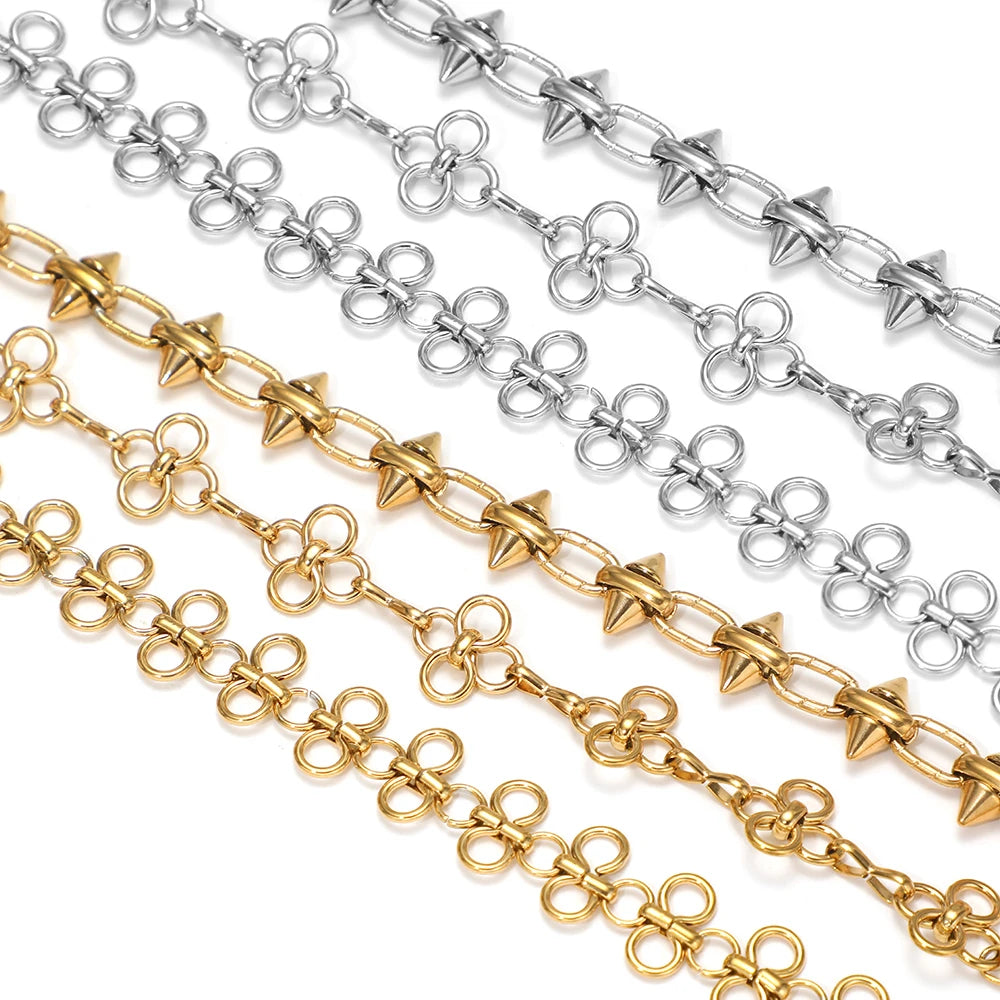 Gold, steel, and silver-toned bow knot chain strands with interlocking links