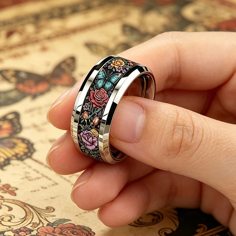 Stainless steel ring with black floral butterfly band, gold-tone inner edge