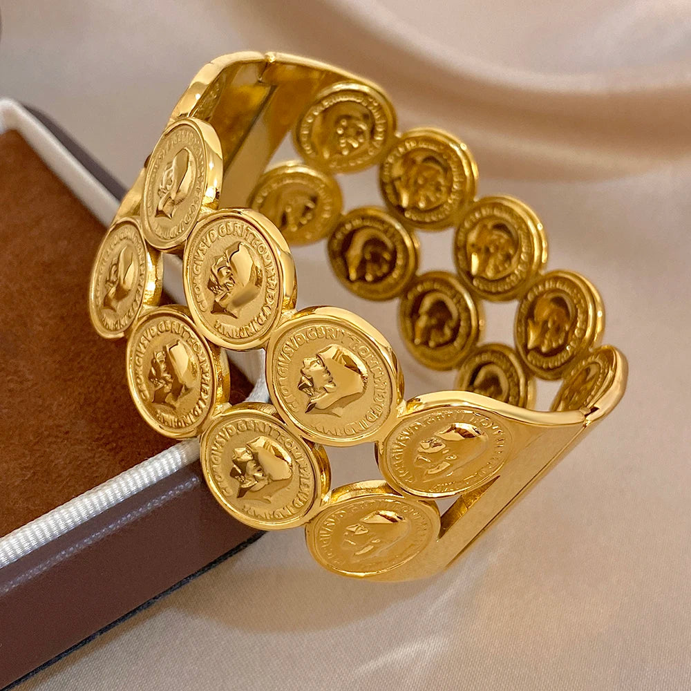 Gold plated coin cuff bangle with human head portrait medallion discs, side angle