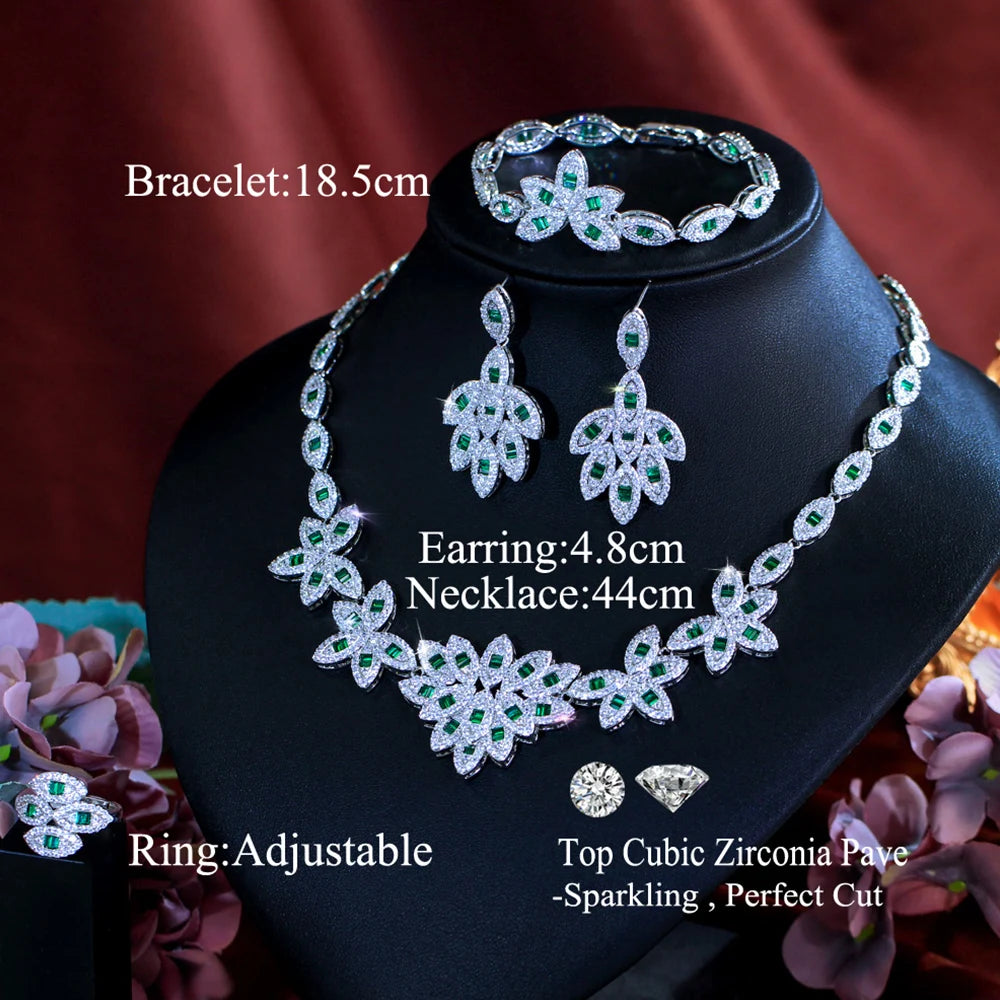 Green zirconia floral jewelry set on display: necklace, drop earrings, bracelet, adjustable ring