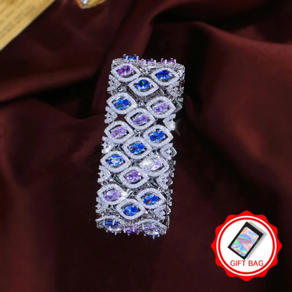 Wide silver-tone bracelet with blue and purple zirconia stones