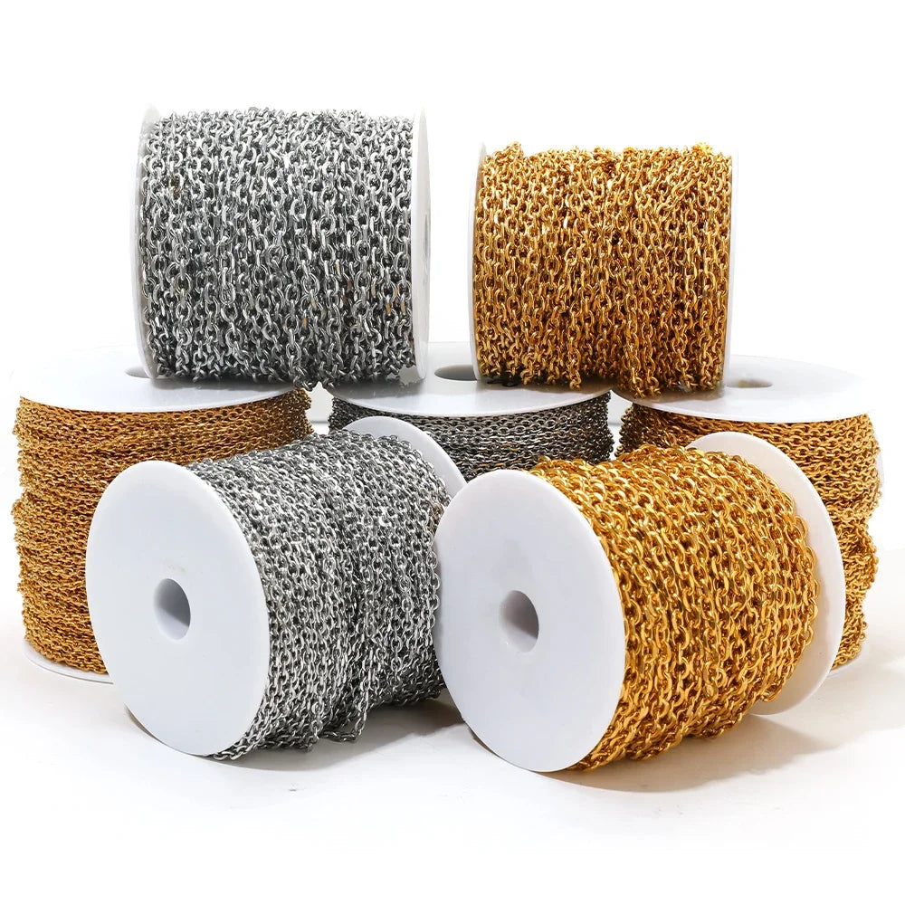 Assorted spools of gold and silver O-link chain with connected oval links