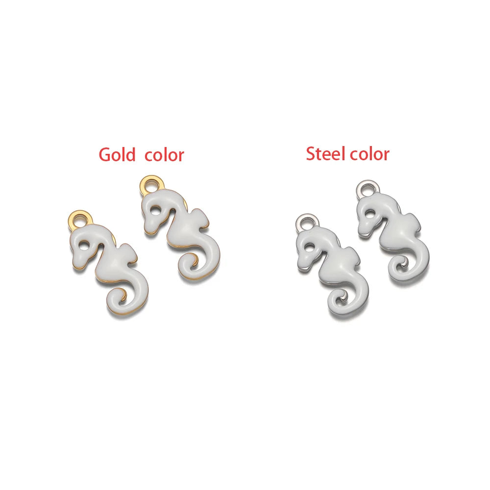 White seahorse-shaped charm set with loop, gold-tone and silver-tone finishes.