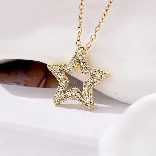 Gold-tone star choker necklace with clear rhinestone star pendant on chain