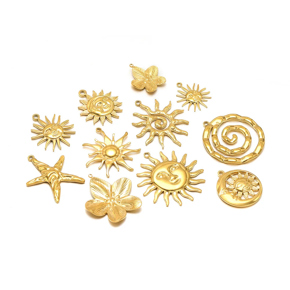 Gold-tone sun, starfish, and butterfly charms with hanging loops for DIY jewelry