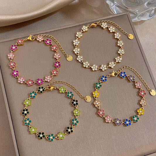 Gold-tone chain bracelet with colorful flower zircon beads and round links, adjustable clasp