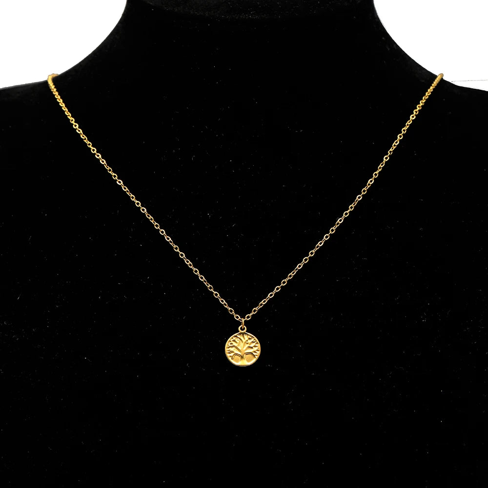 Gold circular animal-themed charm pendant on a chain necklace