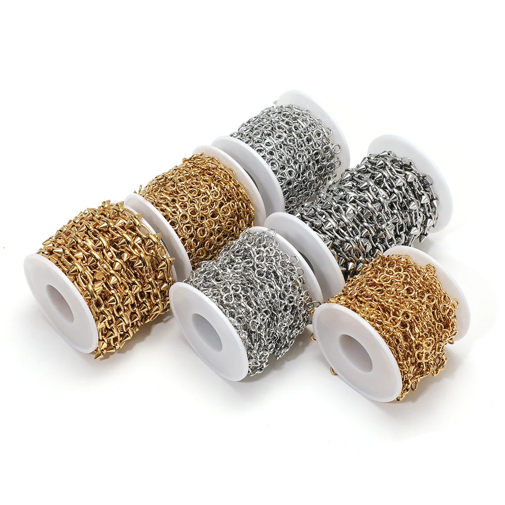 Assorted metal bow knot chain spools in gold, steel, and silver tones