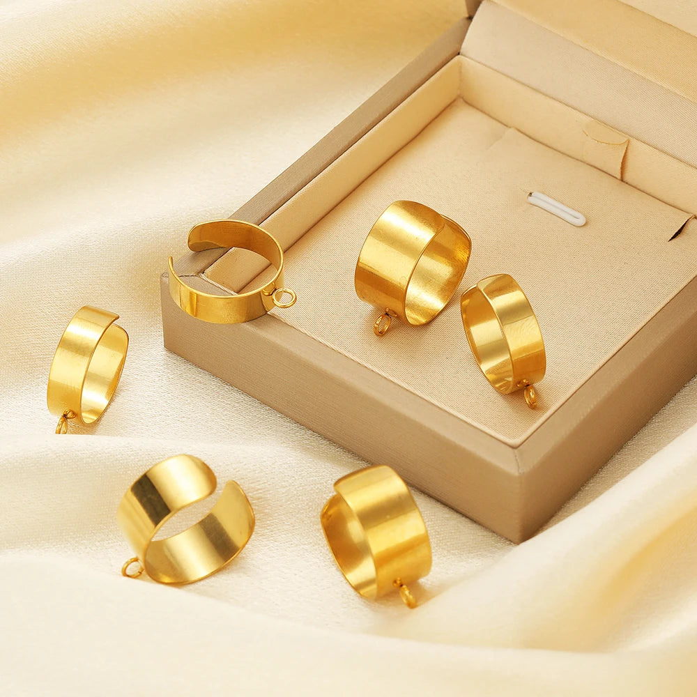 Gold open adjustable ring bases with jump rings in a gift box tray