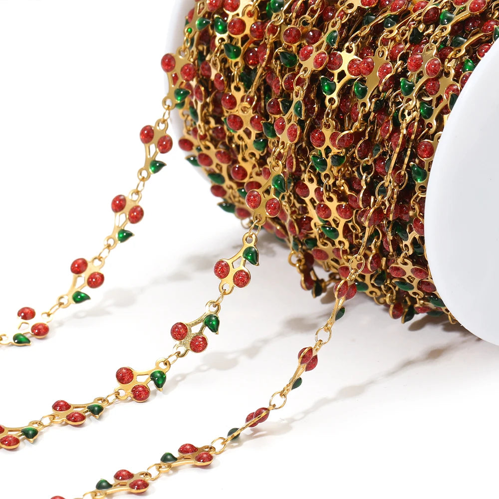 Enamel cherry chain strand with red cherries and green leaf charms, gold links
