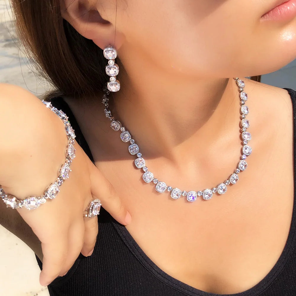 Square cubic zirconia necklace with matching hoop earrings and cushion-cut ring